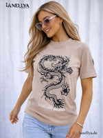 Beiges Damen T-Shirt mit schwarzem Drachenprint und Luxury Brand Schriftzug