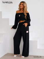 Laki Damen Zweiteiler Schwarz mit Off Shoulder Oberteil und Wide Leg Hose